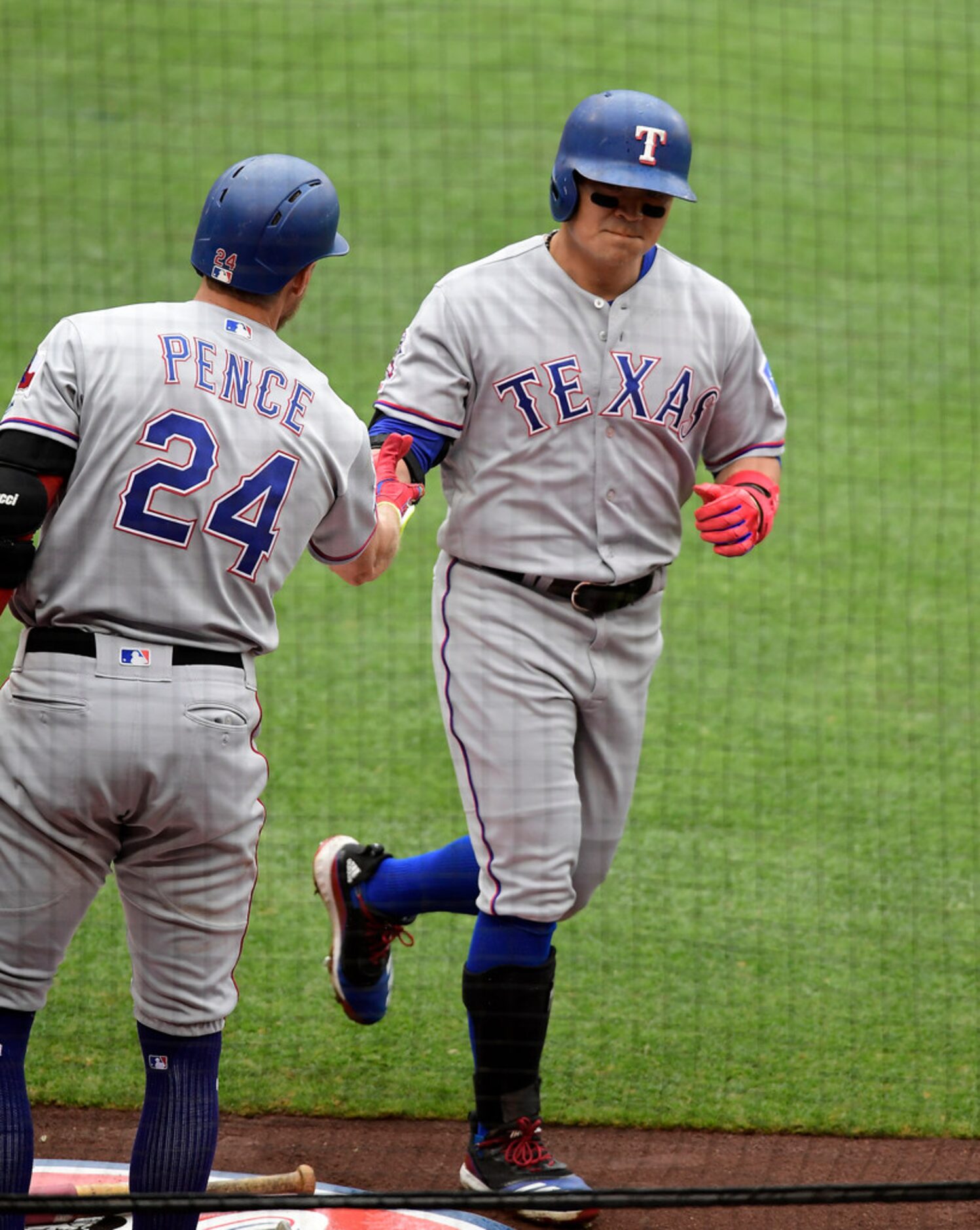 Texas Rangers' Shin-Soo Choo, right, is congratulated by Hunter Pence after hitting a solo...