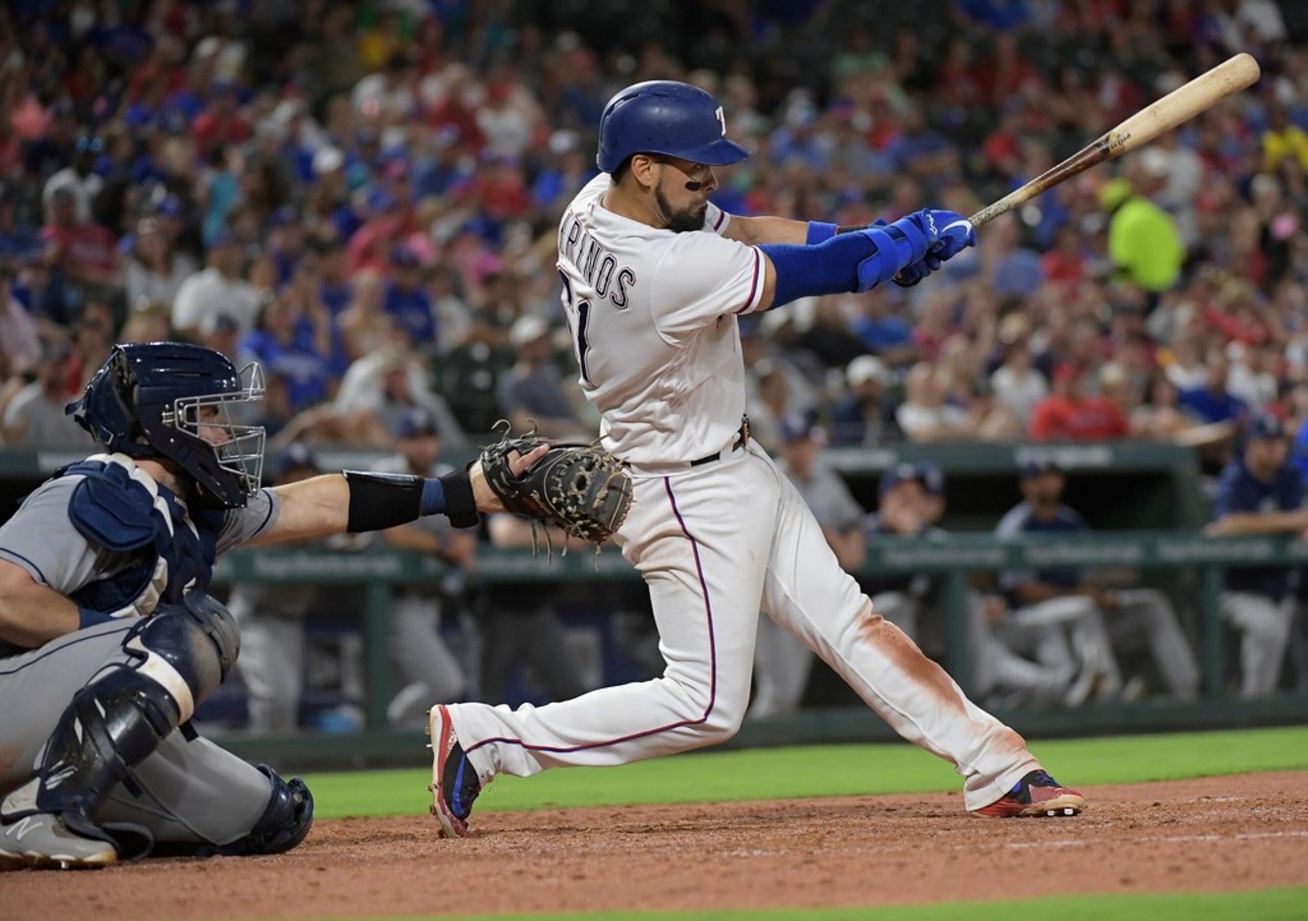 Texas Rangers catcher Robinson Chirinos (61) hits an RBI during the sixth inning as the...