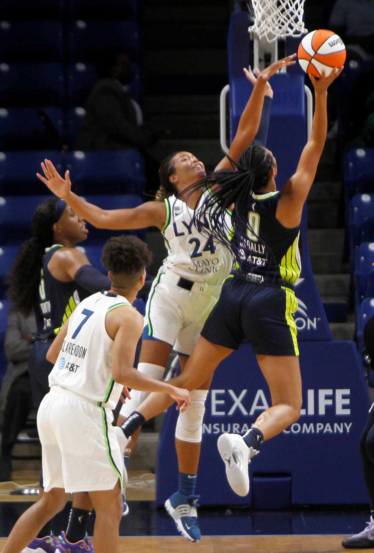 Dallas Wings forward Satou Sabally (0) drives to the basket and draws a foul by Minnesota...