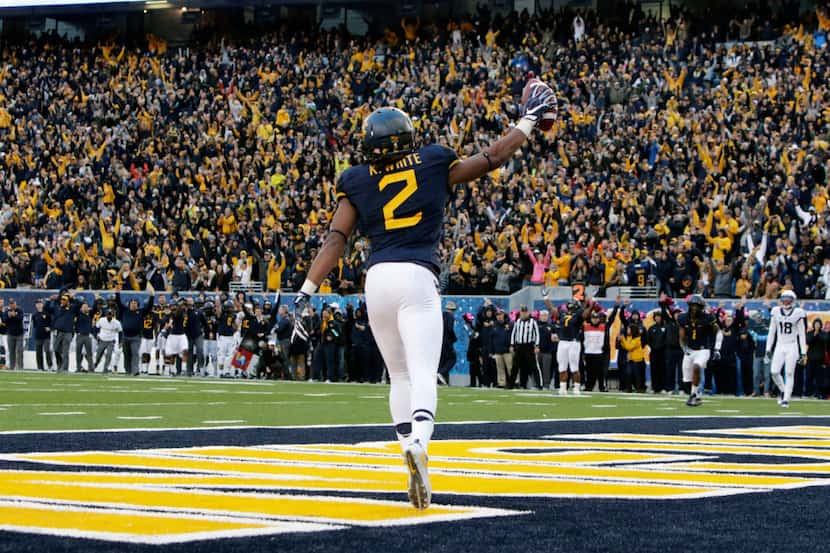 West Virginia wide receiver Ka'Raun White (2) celebrates his touchdown catch during the...
