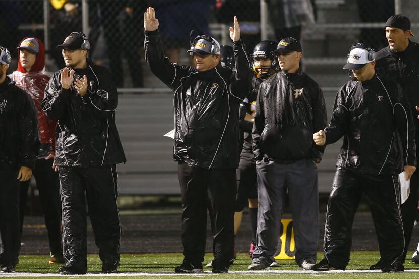 TXHSFB Forney head coach Kevin Rush signals after an extra point attempt against West...