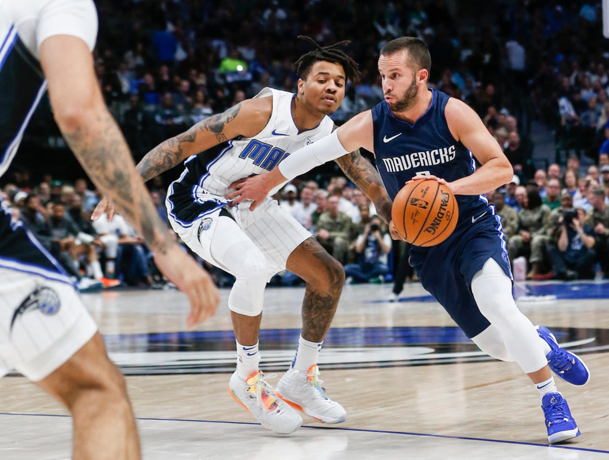 Dallas Mavericks guard J.J. Barea (5) drives past Orlando Magic guard Markelle Fultz (20)...