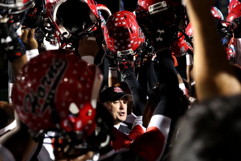 Cedar Hill head coach Joey McGuire speaks to his players before a 6A Division II Region 1...