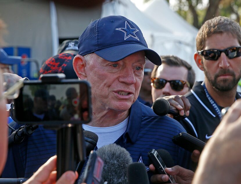 Dallas Cowboys owner Jerry Jones talks with the media after practice at the training camp in...