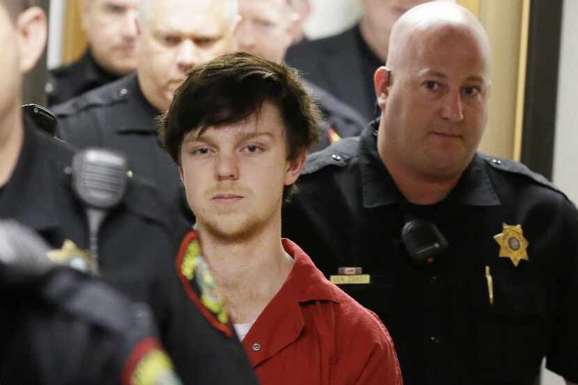 Ethan Couch is led by sheriff's deputies after  a juvenile court for a hearing Friday, Feb....