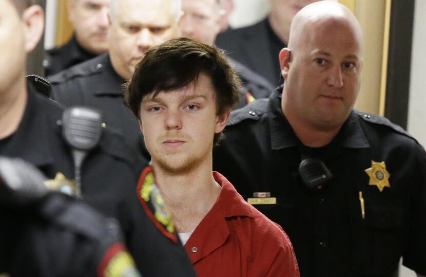 Ethan Couch is led by sheriff deputies after  a juvenile court for a hearing Friday, Feb....