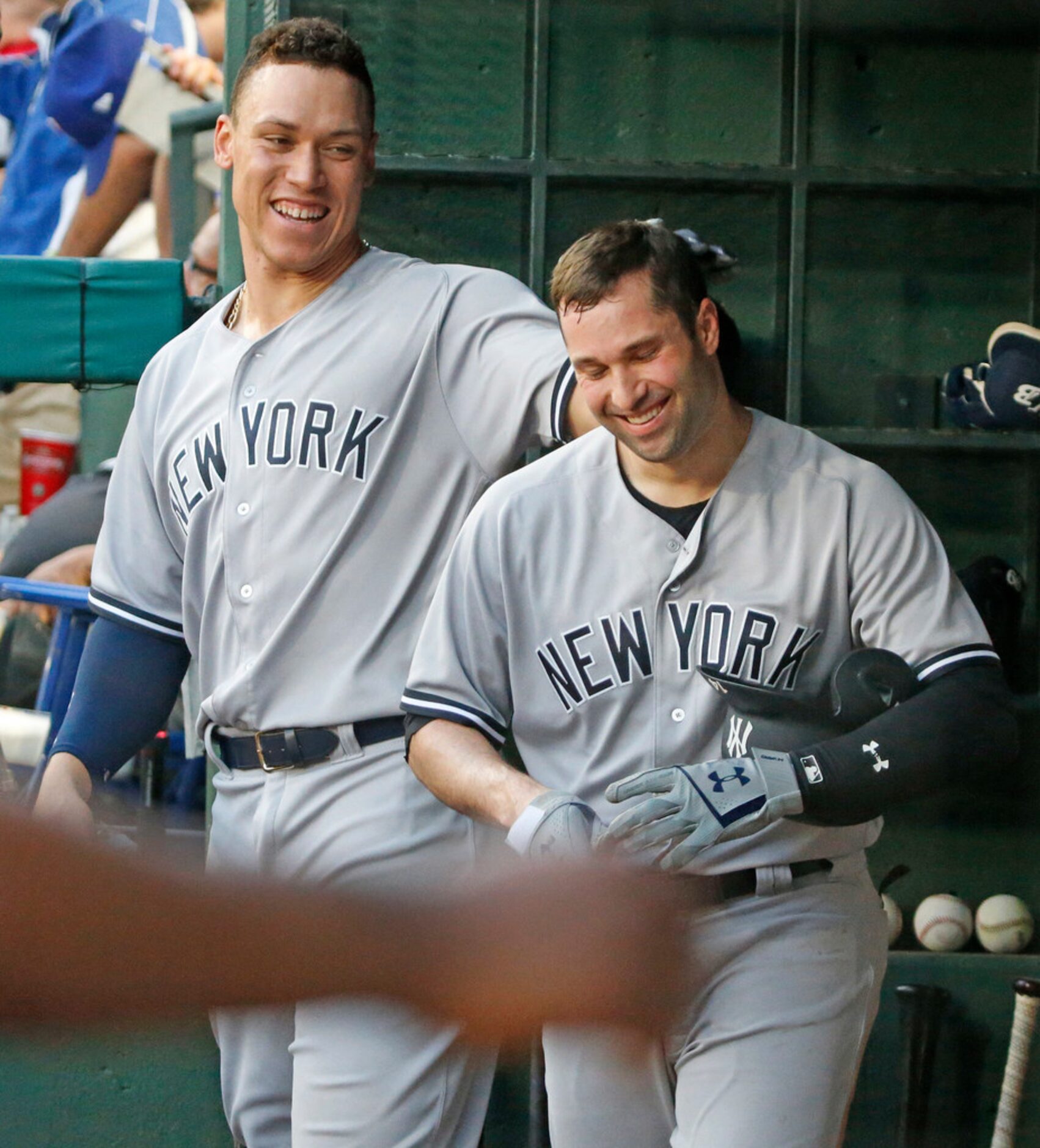 New York Yankees third baseman Neil Walker (14) smiles as he is congreatulted by teammate...