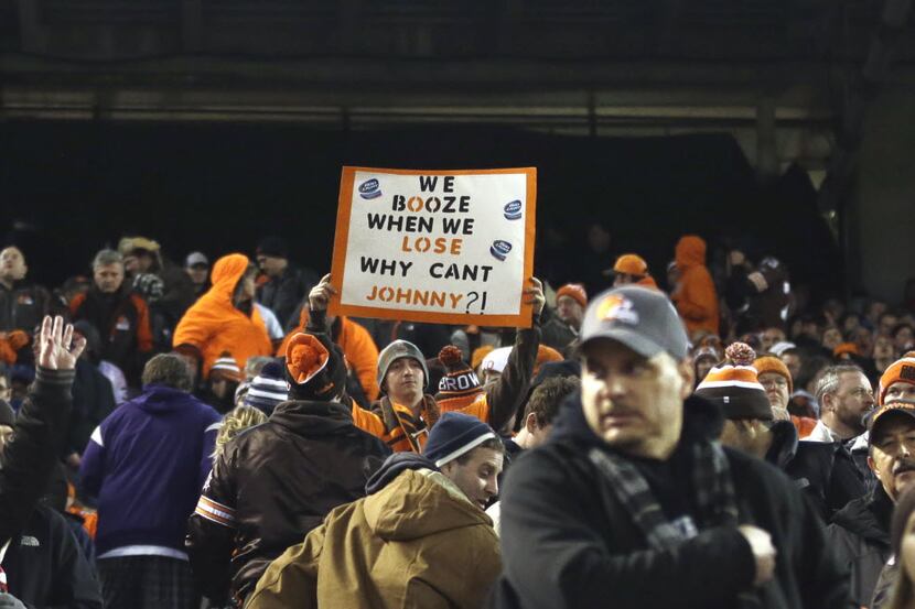 A fan holds a sign referring to Cleveland Browns quarterback Johnny Manziel during an NFL...