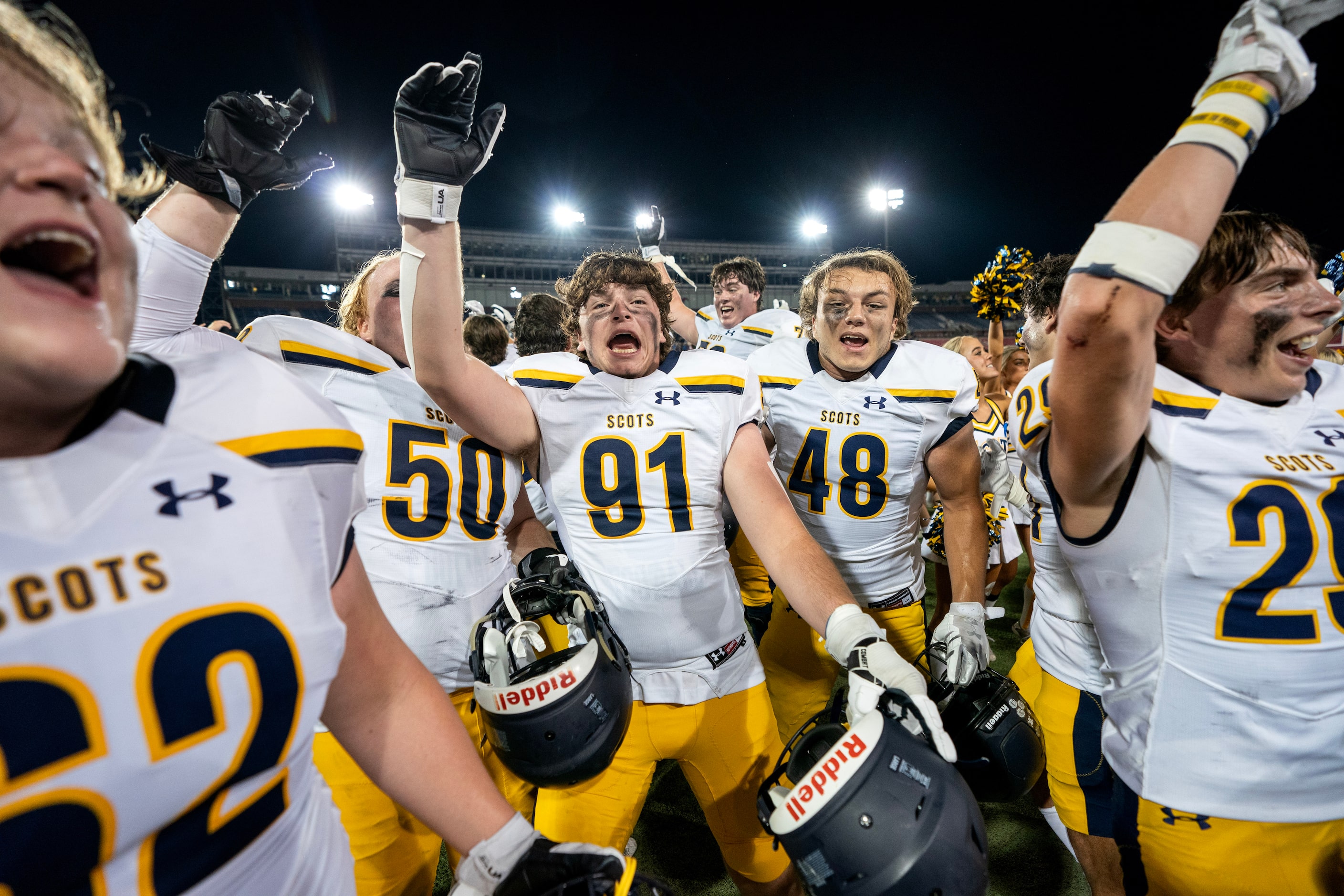 Highland Park senior defensive lineman Chase Grimauld (91) and senior linebacker Daniel...