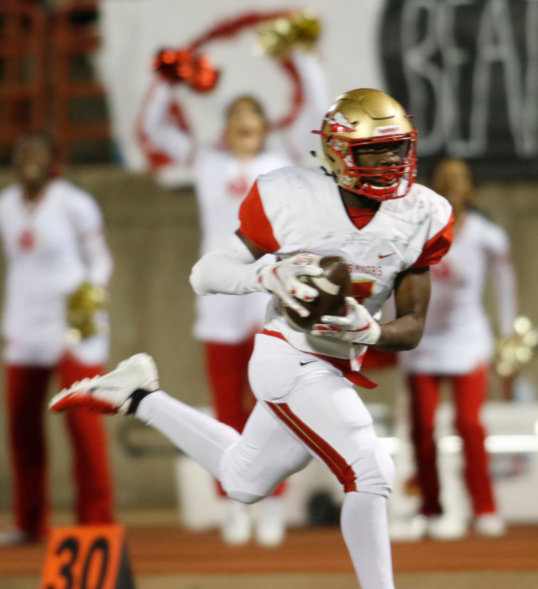 South Grand Prairie receiver Titus Jackson (7) hauls in a long pass for a second quarter...