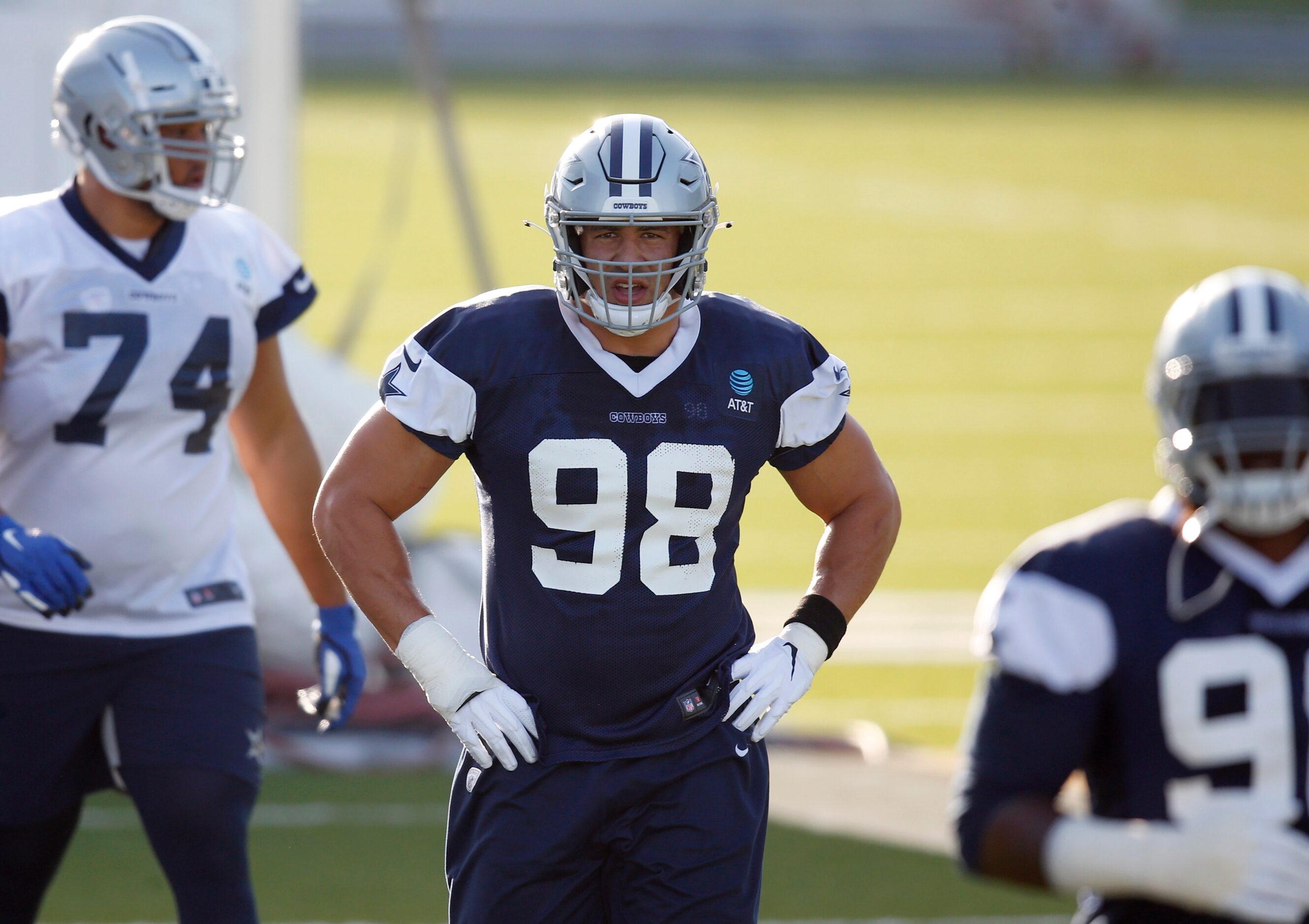 Dallas Cowboys defensive end Tyrone Crawford (98) and teammates take the field for practice...