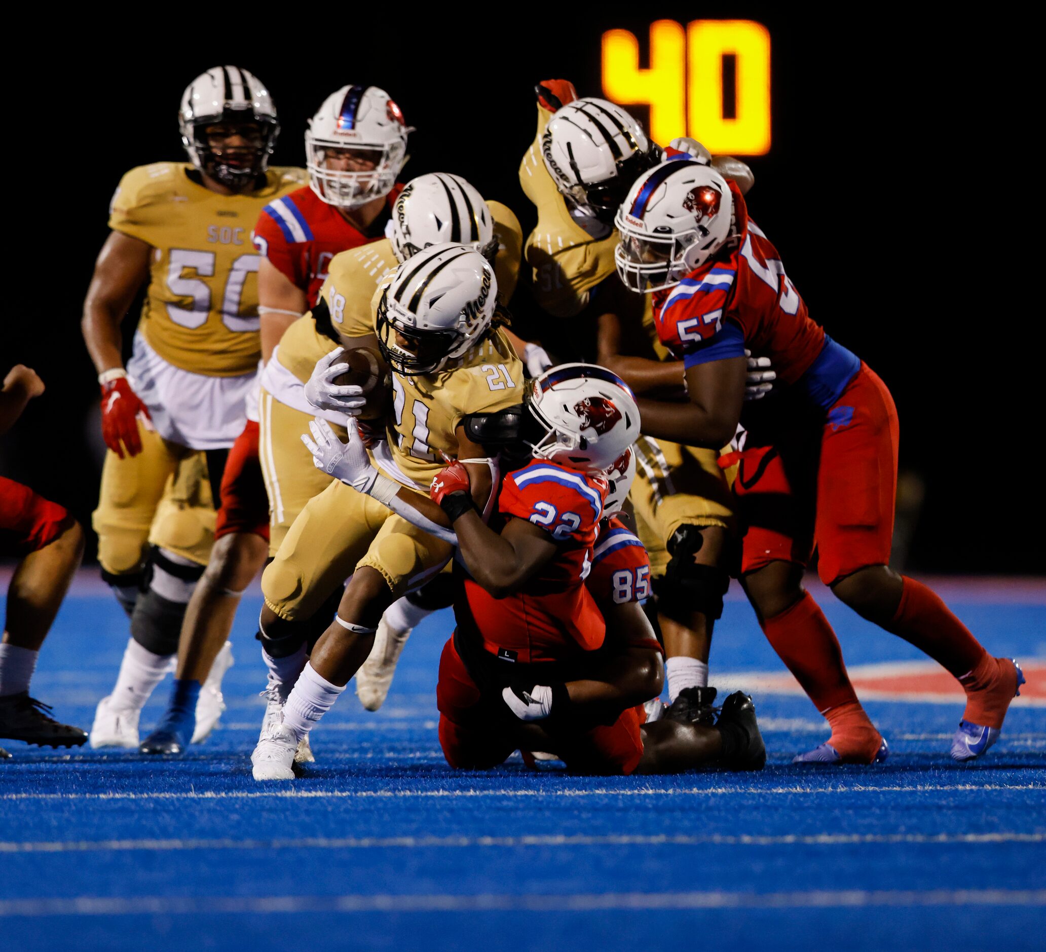 South Oak Cliff’s running back Danny Green (21) is taken down by Parish Episcopal’s...