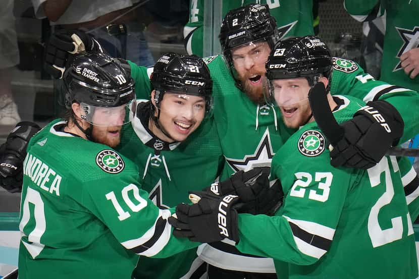 Dallas Stars left wing Jason Robertson (21) celebrates with center Ty Dellandrea (10),...