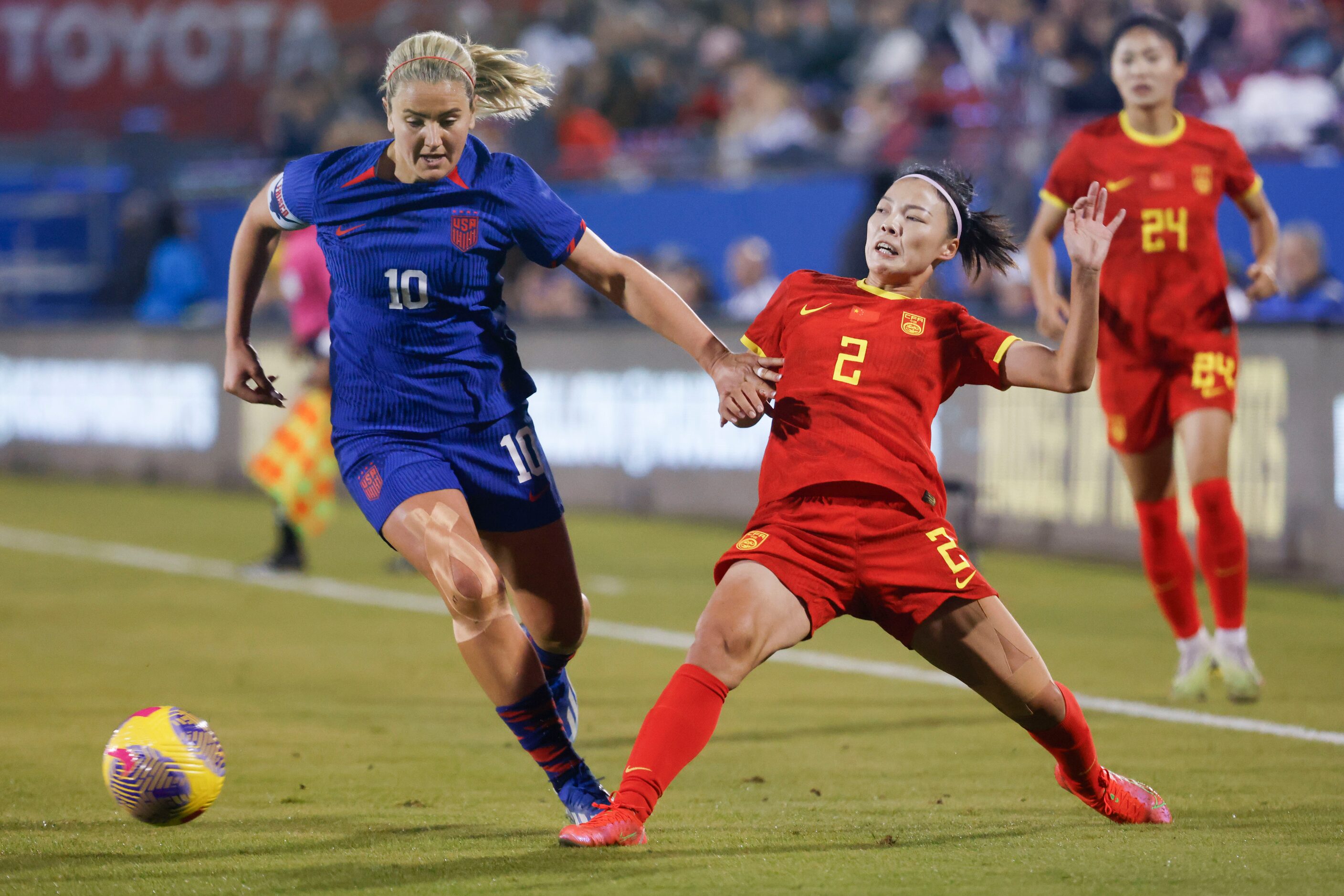 United States’ Lindsey Horan (10) goes past China’s Li Mengwen during the first half of a...