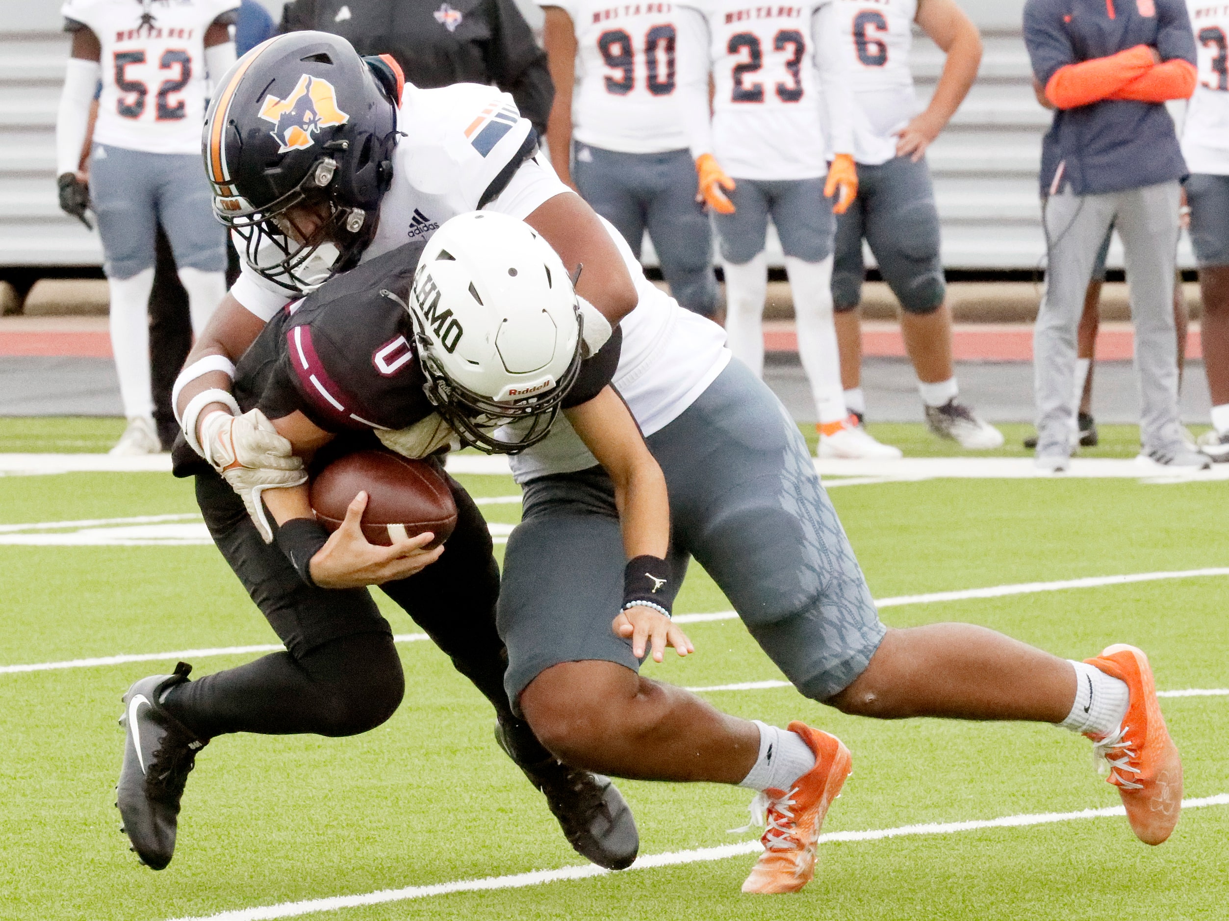 Sachse High School middle linebacker Vashon Brunswick (7) tackles Wylie High School...