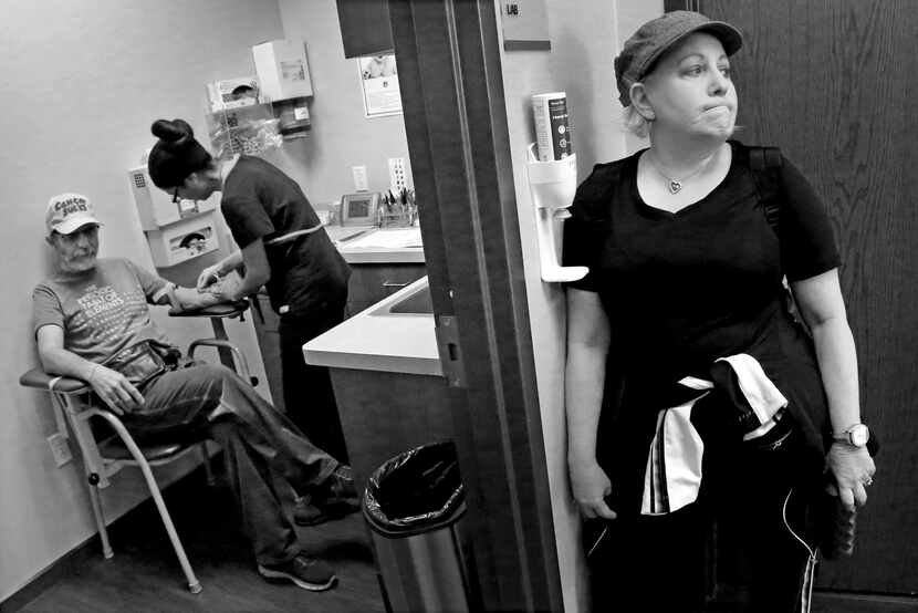 Weiss' wife, Marni, waits as her husband has blood drawn at Dr. Karen Fink's office at...