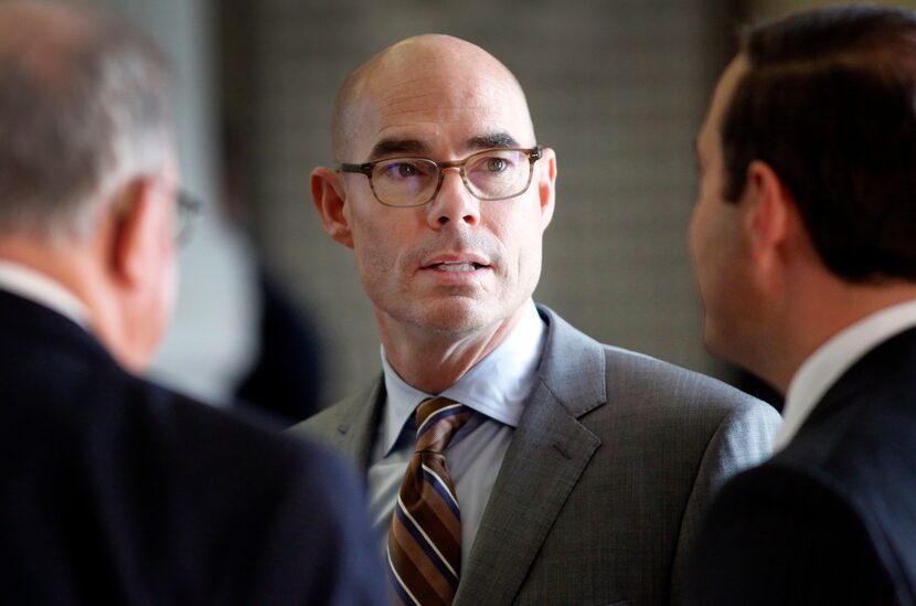 Texas Speaker of the House Honorable Dennis Bonnen (center) visits with colleagues during...