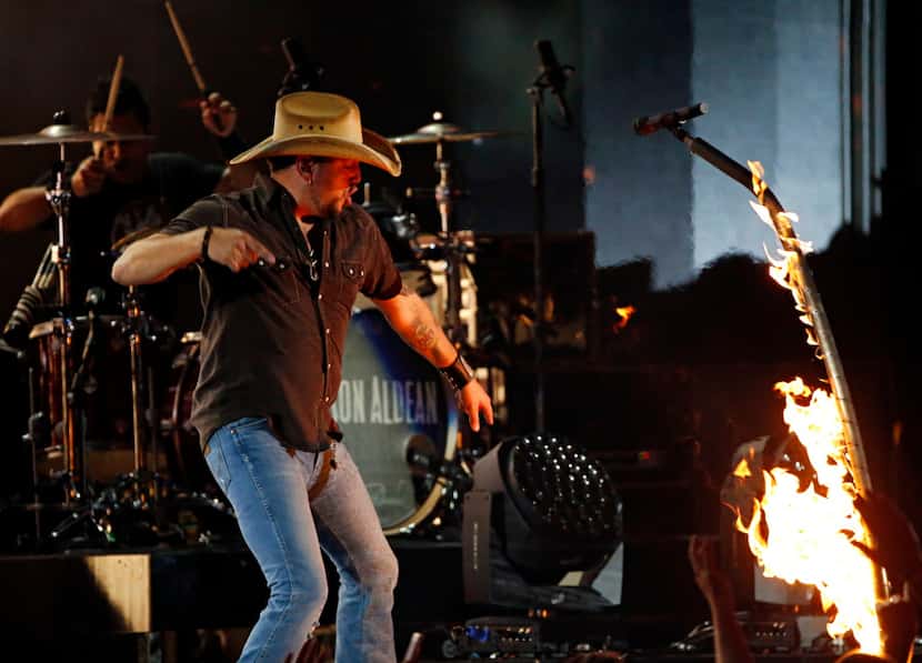 Jason Aldean sets his microphone stand on fire during the 2015 Academy of Country Music...