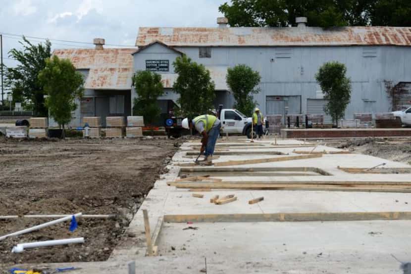 
Crews work on site at the ongoing construction on Main Street in Rowlett. City leaders hope...