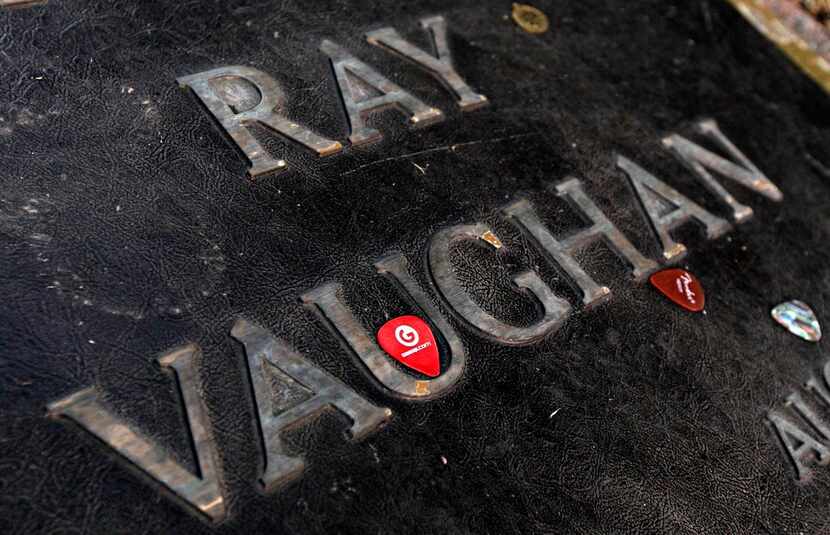 Guitar picks are placed on the grave marker of Stevie Ray Vaughan at Laurel Land Memorial...