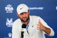 Scottie Scheffler speaks during a news conference at after the second round of the PGA...