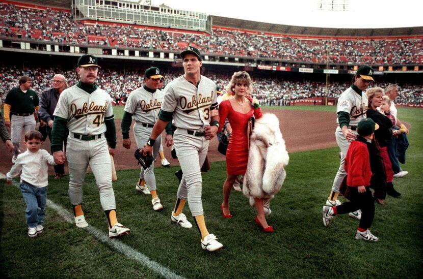 Oakland A's players leave the field with their families at San Francisco's Candlestick Park...