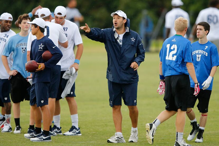 Dallas Cowboys quarterback Tony Romo (9) instructs players where to go before the start of...