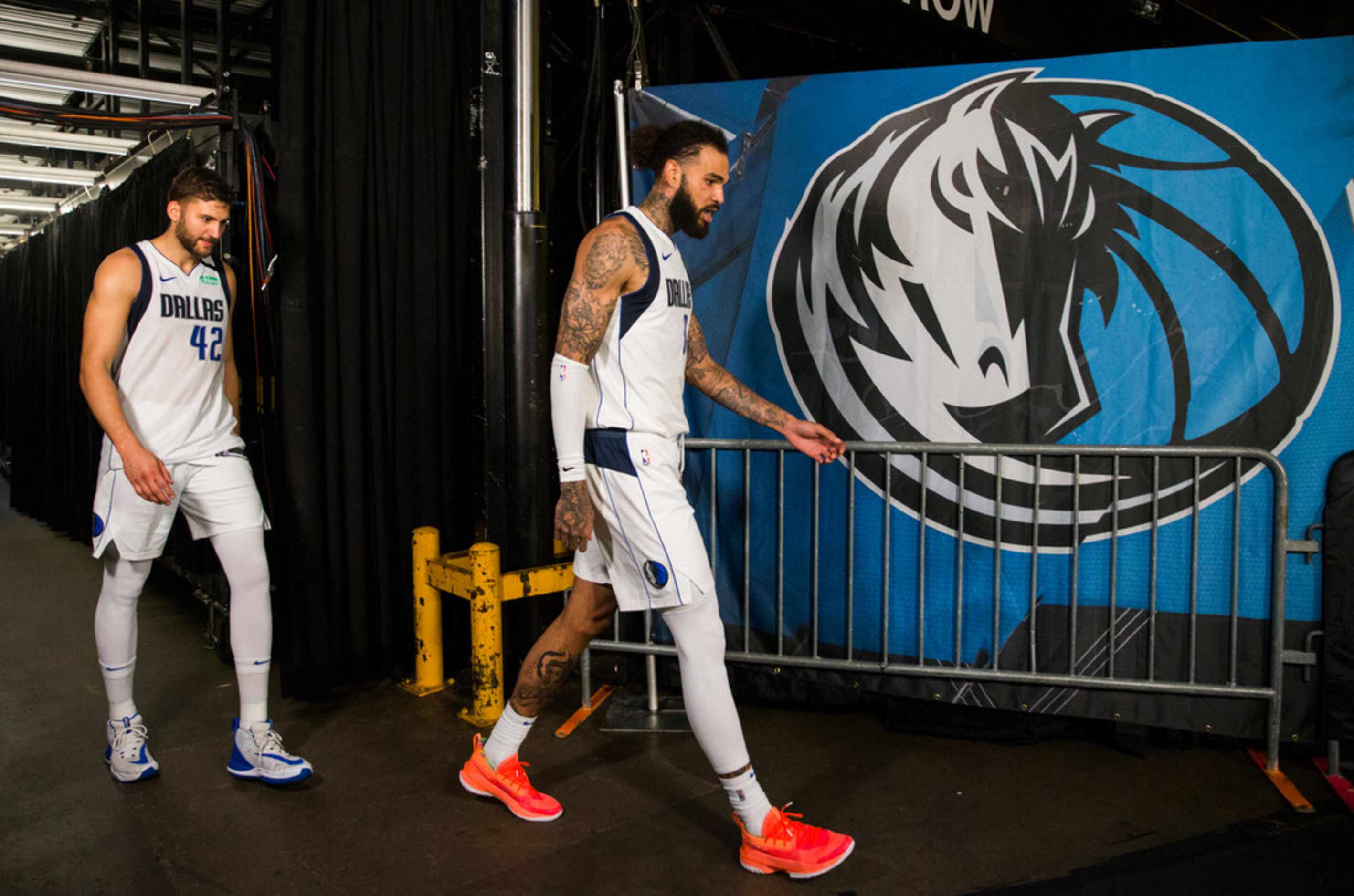 Dallas Mavericks forward Maxi Kleber (42) and center Willie Cauley-Stein (33) walk off the...