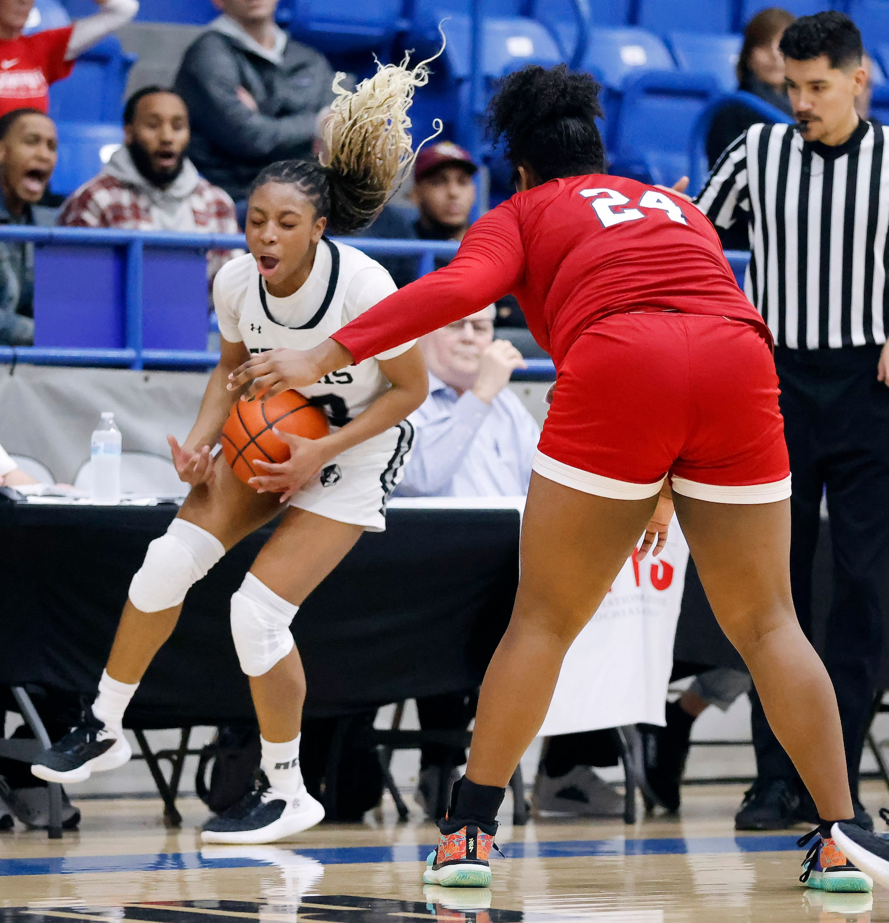 Bishop Lynch guard Mikah Ford (23) reacts after going out of bounds with the ball as she...