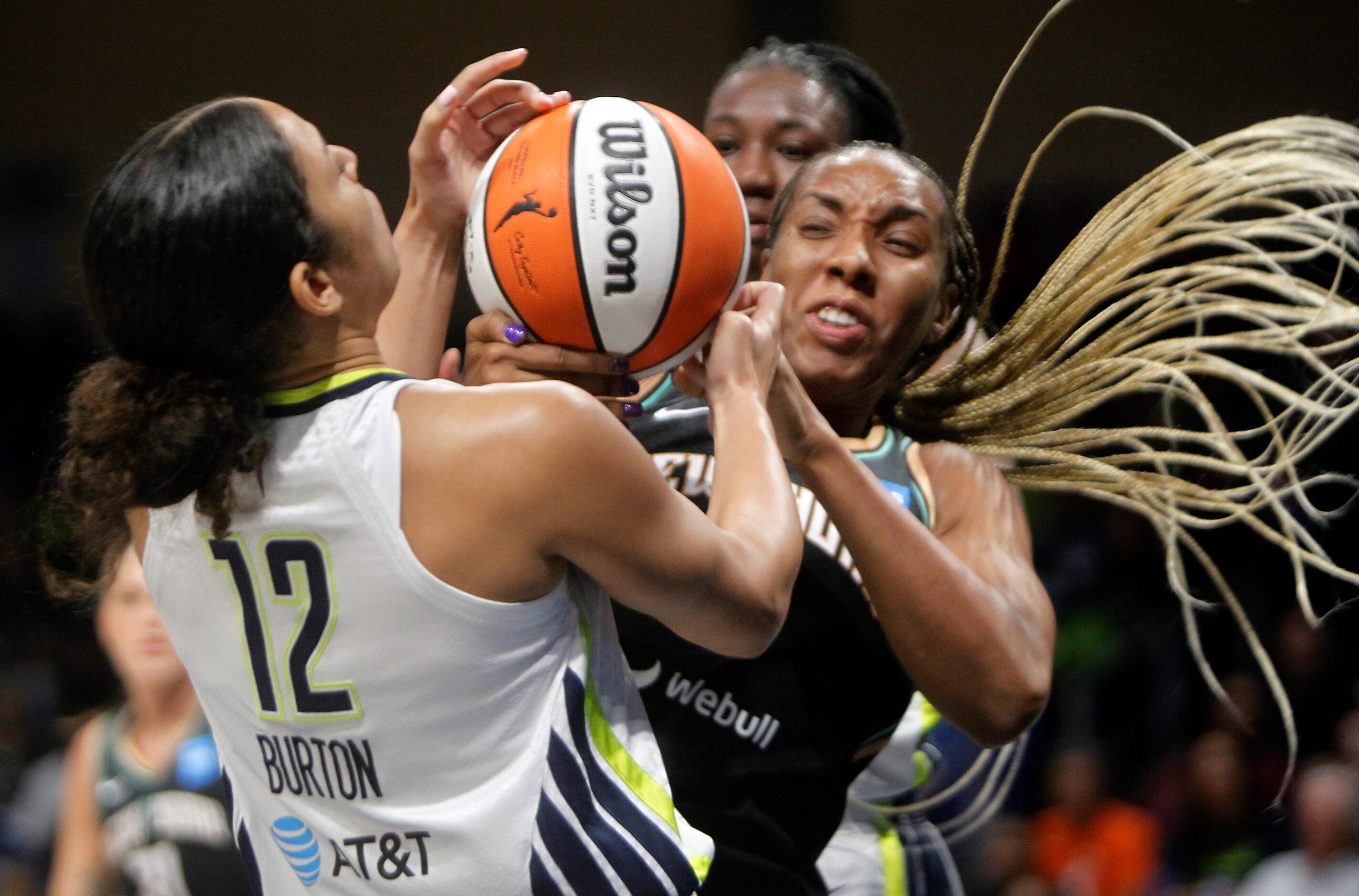 Dallas Wings guard Veronica Burton (12), left, battles New York Liberty forward Kayla...