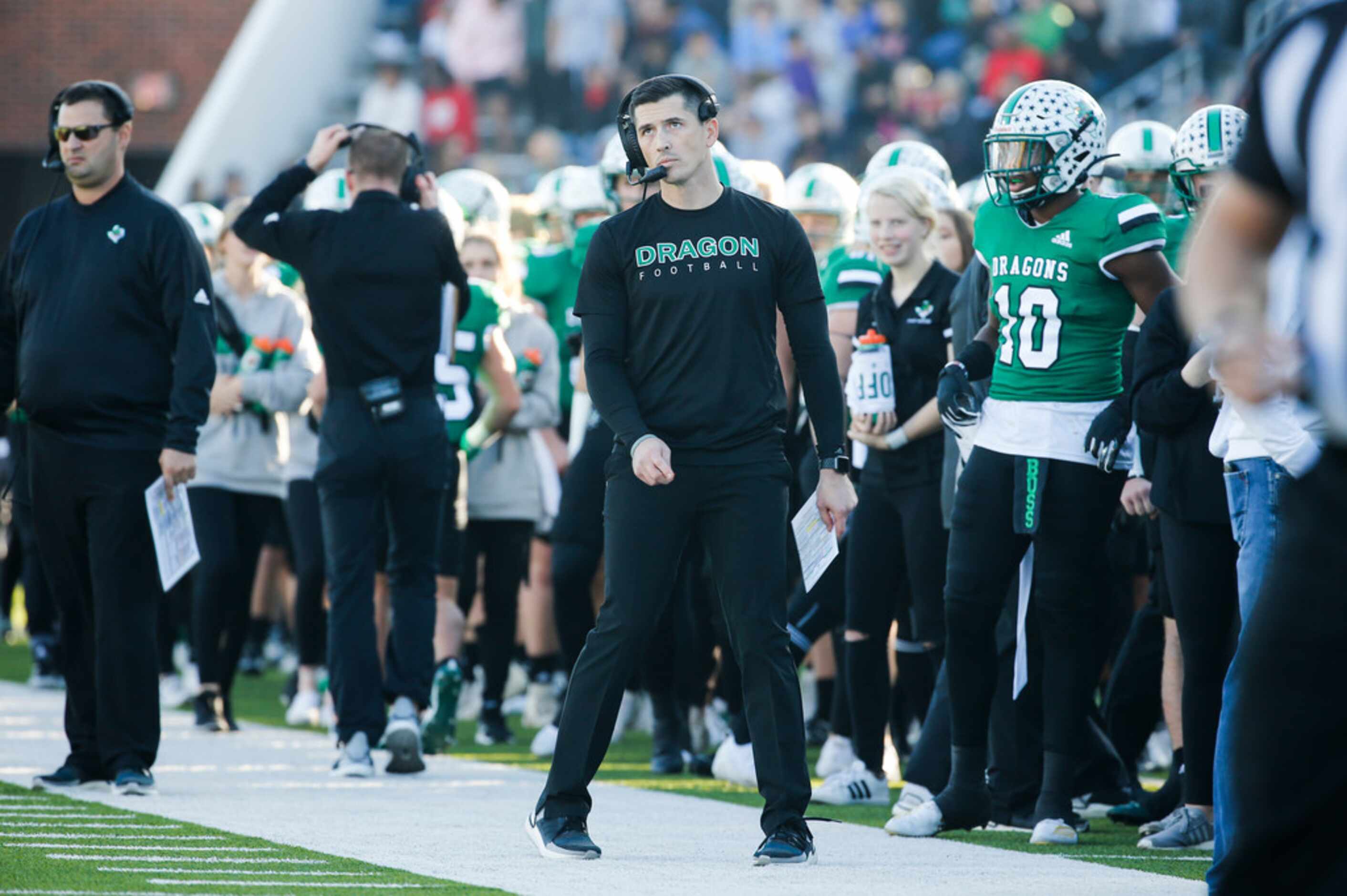 Southlake Carroll head coach Riley Dodge, center, works the sideline during the second half...
