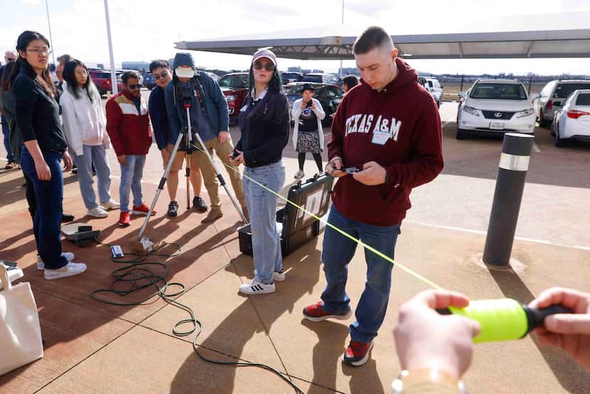 Participants of Texas A&M University take part in a training session to build telescopes...