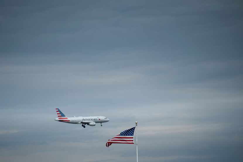 In this photo taken on May 9, 2019 an American Airlines passenger jet approaches Ronald...