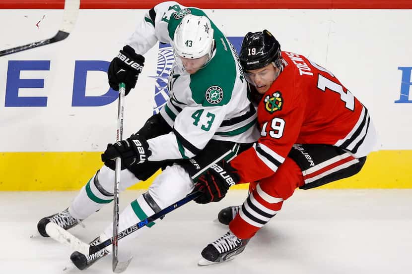 Dallas Stars right wing Valeri Nichushkin (43) maneuvers for the puck with Chicago...