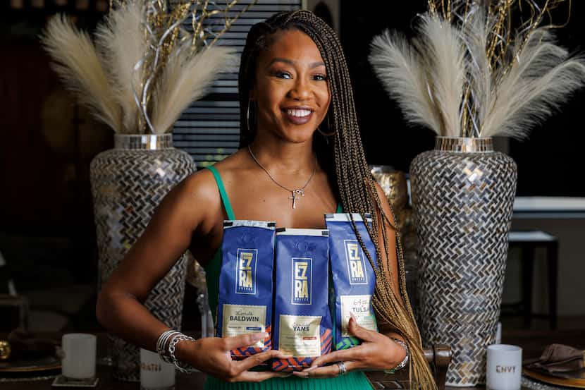 Ezra Coffee CEO Jessica Taylor holds various blends of Ezra Coffee in her Dallas apartment.