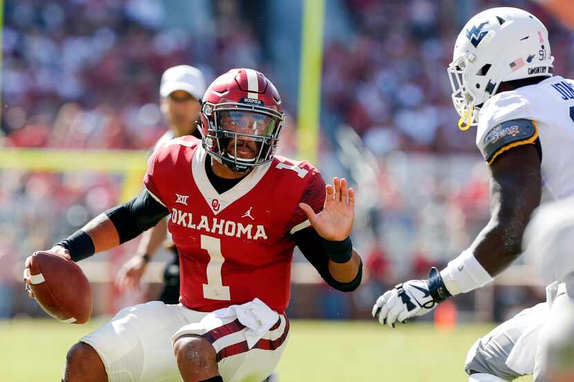 Oklahoma quarterback Jalen Hurts (1) runs against West Virginia during the first half of an...