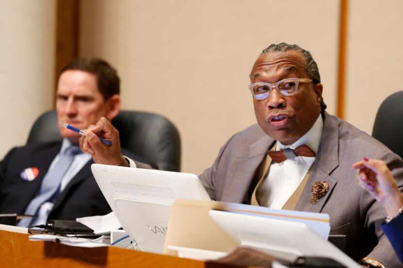 Dallas County Commissioner John Wiley Price (center), with County Judge Clay Jenkins (left)...