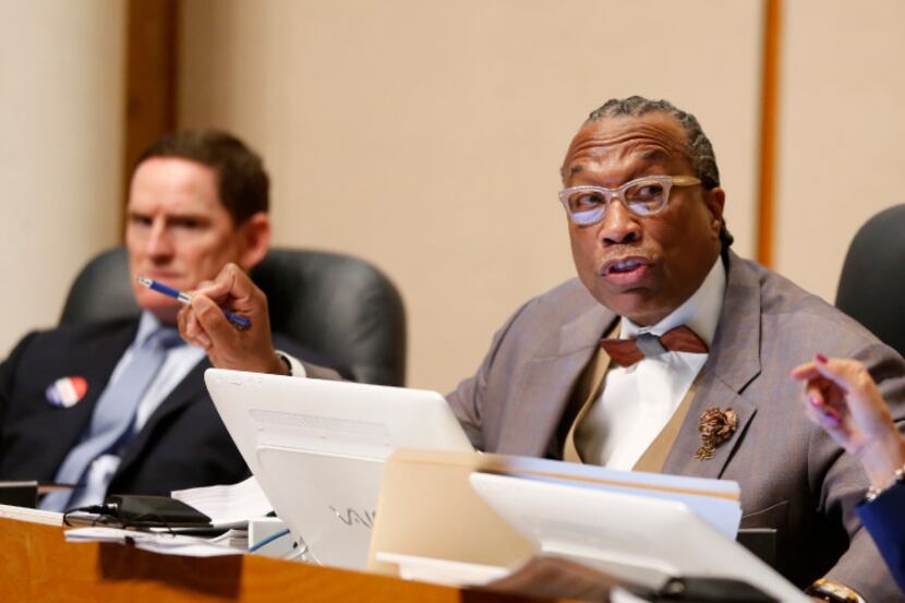 Dallas County Commissioner John Wiley Price (center), with County Judge Clay Jenkins (left)...