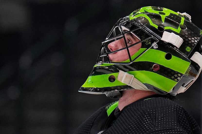 Dallas Stars goaltender Jake Oettinger looks up during a time out in the second period of an...