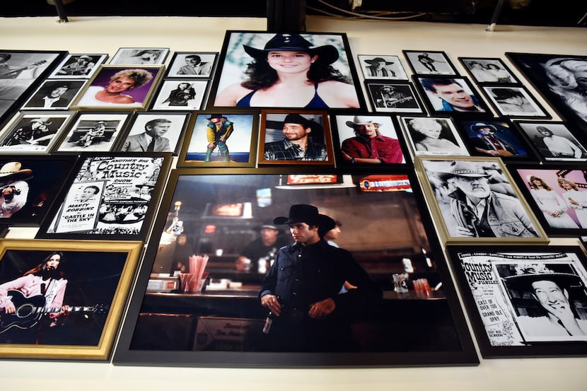 You can't have a wall of country queens and honky tonk cowboys without Alan Jackson in his...