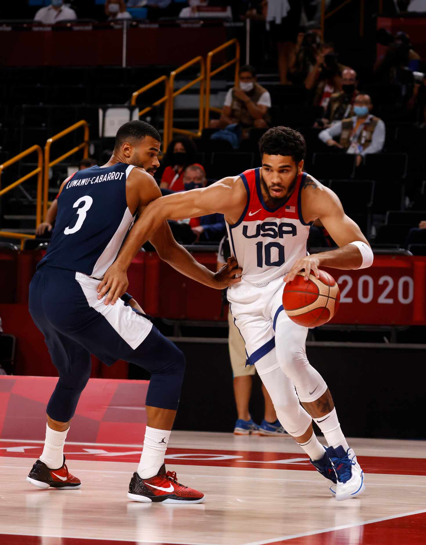 USA’s Jayson Tatum (10) drives on France’s Timothe Luwawu Cabarrot (3) during the first half...