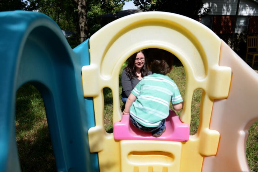 Jennifer Chandler plays with her son Liam, 2, at their home in the Northrich neighborhood in...