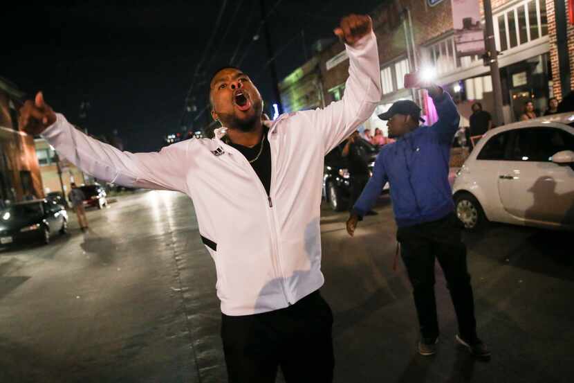 Demonstrators march through the street during a protest Saturday, March 23, 2019 in Dallas'...