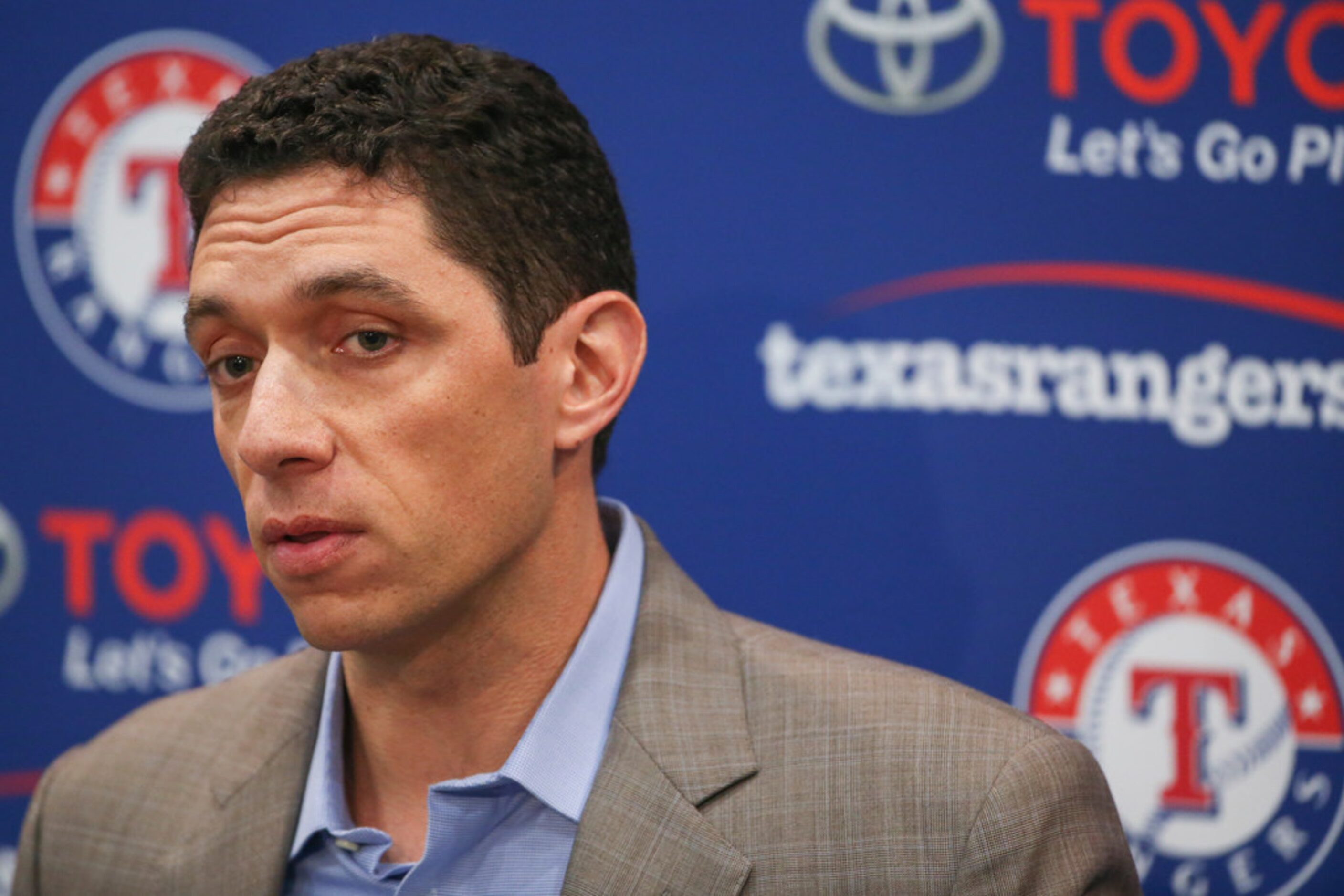 Rangers President of Baseball Operations and General Manager Jon Daniels addresses members...