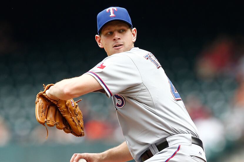 HOUSTON - MAY 12:  Nick Tepesch #49 of the Texas Rangers pitches in the first inning Houston...