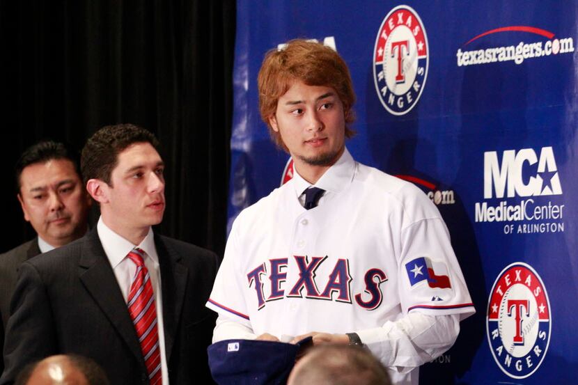 Texas Rangers manager Jon Daniels and new Texas Rangers pitcher Yu Darvish after Darvish was...