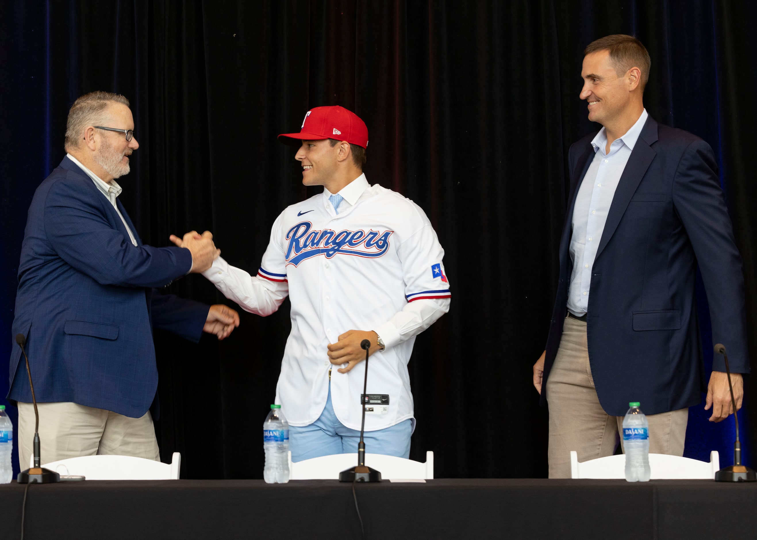 Kip Fagg (left), Texas Rangers Senior Director of Amateur Scouting, Chris Young (right),...