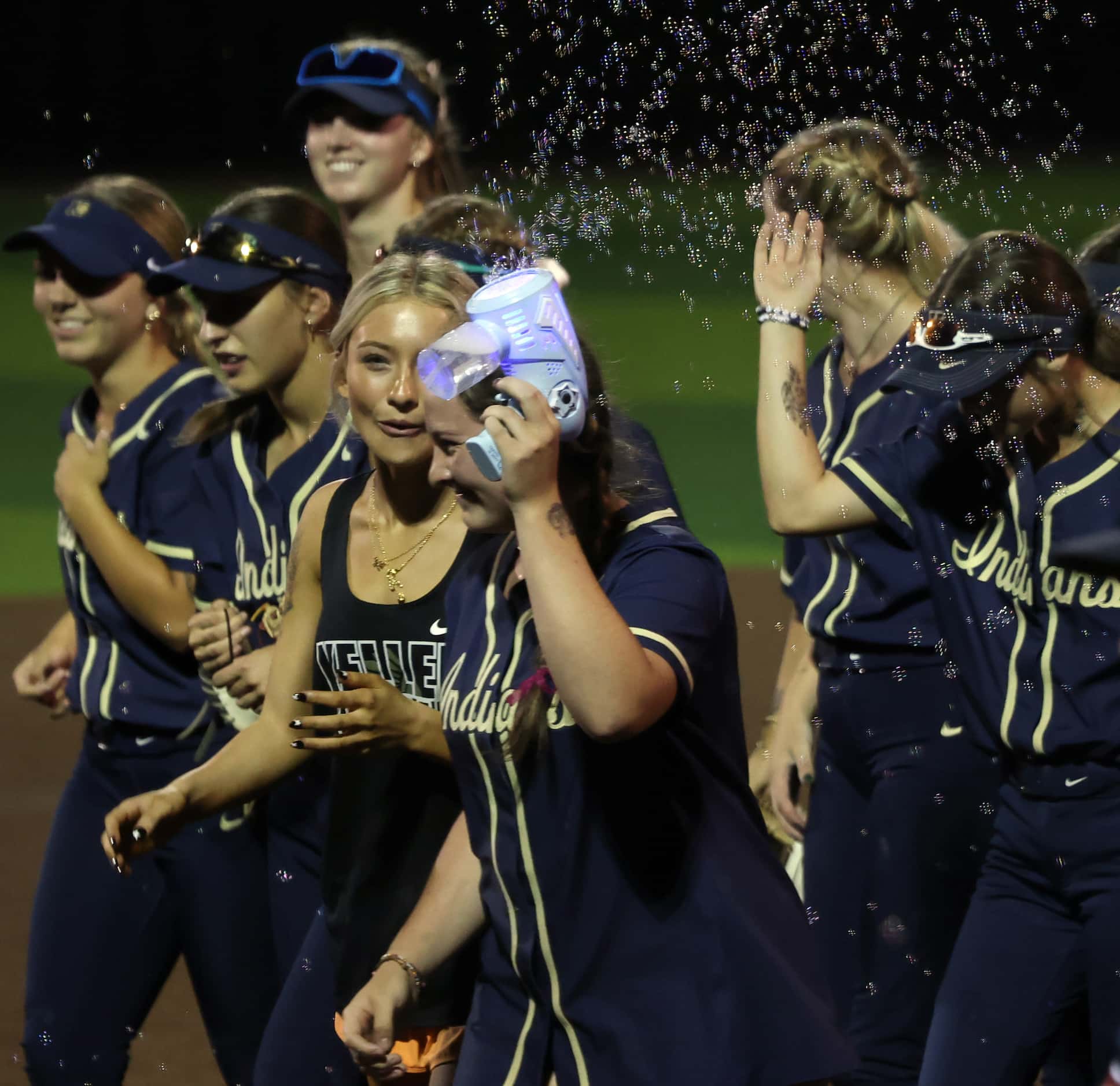 Keller players celebrate following their 10-0 victory in 6 innings over Plano West to...