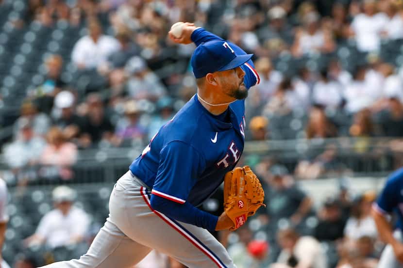 Texas Rangers starting pitcher Martin Perez (54) delivers against the Pittsburgh Pirates in...