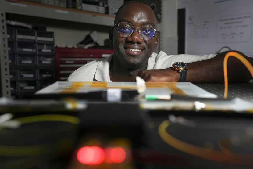 Research assistant Jaime da Silva with a microresonator that SMU helped create for NASA in a...